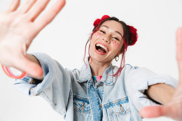 Image closeup of cheerful woman smiling and taking selfie photo