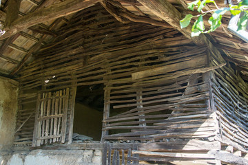 Fototapeta na wymiar Details of an old wooden house, wooden barn structure, rural scene, interior of an abandoned house