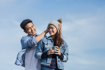 Asian couple enjoying nature view outdoor, lifestyle concept.