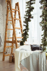 Decorated wooden staircase and hammock with fir branches for Christmas holiday