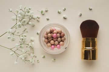 Top view blush and brush on table