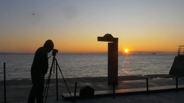 Photographer takes photos of sunrise at Domus Solis in Odessa 
