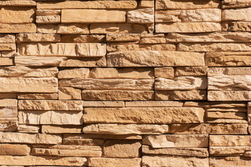 Tile stone wall pattern texture. For background or floor. Fragment of a wall from a chipped stone