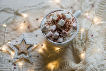 Winter hot drink, cacao with marshmallows and christmas decorations, spicy hot chocolate
