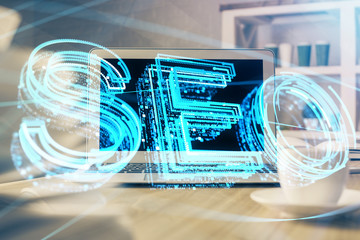 Multi exposure of table with computer and seo drawing hologram. Search optimization concept.