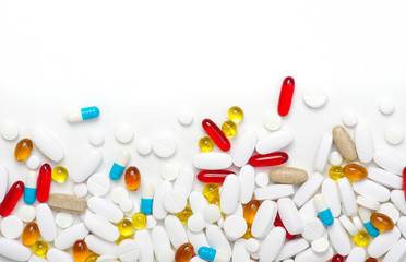  Pills, tablets and capsules on white background.