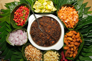 miang kum, leaf-wrapped bite-size appetizer