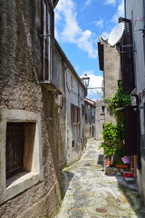 Province of Salerno, Italy, 05/27/2017. A narrow street among the old houses of a mountain village.