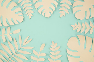 Fototapeta premium Copy space and tropical leaves in paper cut style