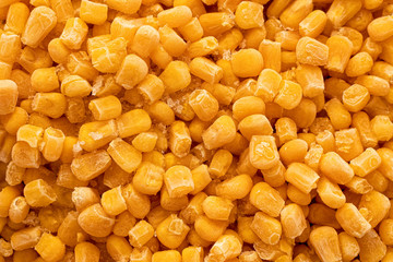 Background of frozen sweet corn. Top view.
