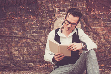 Reading a book.