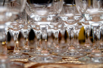 Glass glasses stand on a buffet table 
