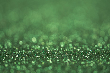 abstract sparkle green background, defocused green glitter background for christmas card, festive...