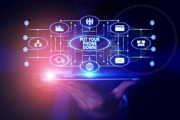 Word writing text Put Your Phone Down. Business photo showcasing end telephone connection saying goodbye caller Woman wear formal work suit presenting presentation using smart device
