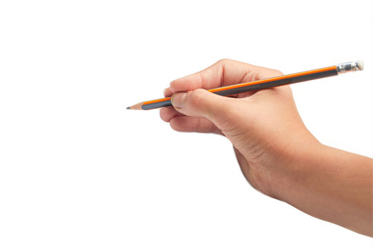 Child hand draws a pencil. Isolated on white background. Blank sheet. Above view. Hand write on a paper with a pencil.