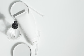 fresh beauty spa medical skincare and cosmetic lotion cream facial tube bottle packaging product on white decor background with summer season sun light