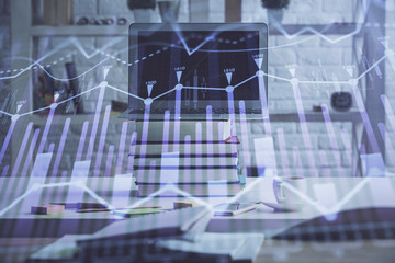 Forex market chart hologram and personal computer background. Multi exposure. Concept of investment.