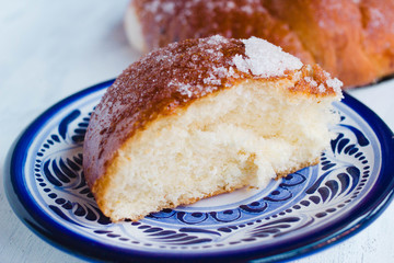 Mexican pan de muertos slice. Detailed view of this sweet bread typical for the day of the deaths in Mexico