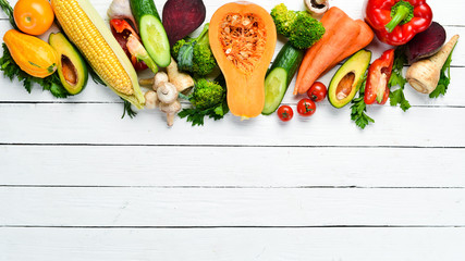 Fresh vegetables on white wooden background. Healthy food. Top view. Free copy space.