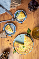 sharing an aperitif with tortilla, olives and red wine