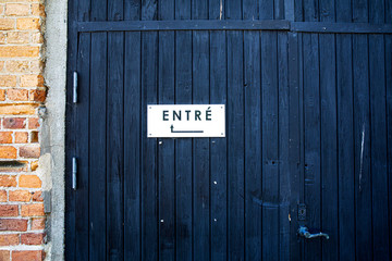 door with an entrance sign