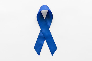 Dark blue awareness ribbon on white background