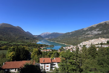 Fototapeta na wymiar Barrea, Italy - 12 October 2019: Lake Barrea and the mountain village