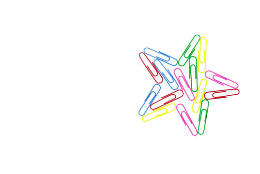 Series of colorful paper clips with star shape on white background. Decorative paper clips in pink, yellow, green, red and blue colors