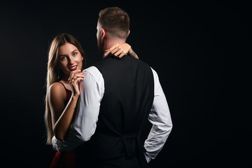 happy woman enjoying waltz with her boyfriend in the studio, close up portrait, copy space.