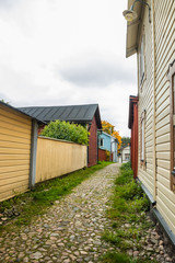 Narrow street of Old Porvoo, Finland. Beautiful city autumn landscape with colorful wooden buildings.
