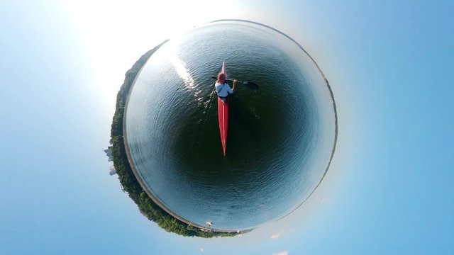 360-degree reverse panorama of a person sailing on a canoe