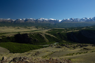 Fototapeta na wymiar Snow capped mountains of the Chuysky Range, Altai Republic, Russia