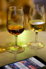 Always online with mobile phone and sherry wine in glass, work pressure and burnout problems