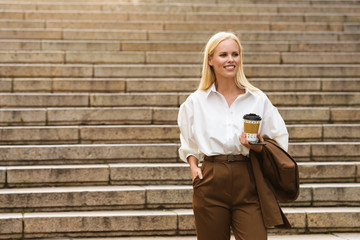 Amazing business woman walking by steps