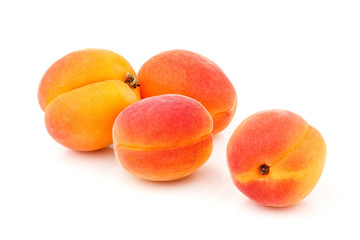 Whole ripe apricots isolated.