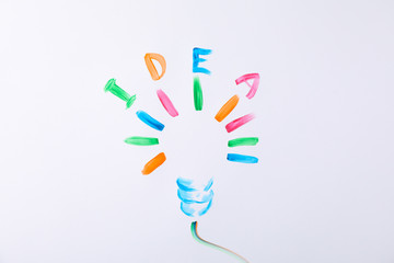 Drawn light bulb and inscription Idea on white background, space for text