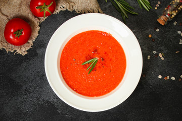 gazpacho, tomato or carrot soup with vegetables (delicious feather dish, healthy cooking) menu concept. food background. copy space. Top view