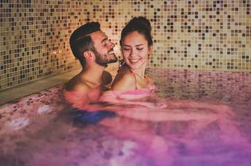 Young couple having spa in thermal resort hotel 
