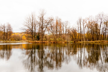 Russia, Moscow Region - October 13, 2019: Beautiful autumnal view of pond in manor Serednikovo in Firsanovka.