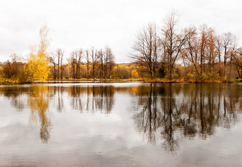 Russia, Moscow Region - October 13, 2019: Beautiful autumnal view of pond in manor Serednikovo in Firsanovka.