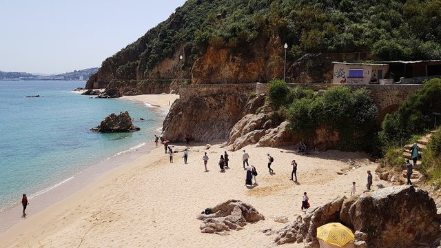 To the west of the city of Skikda on the shores of the Mediterranean Sea is the picturesque Grand Beach with yellow sand. Algeria. April 27, 2018