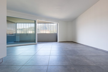 Obraz premium Front wall view with large window with covered balcony and view of the Swiss mountains