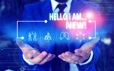 Handwriting text Hello I Am New. Conceptual photo used as greeting or to begin telephone conversation Male human wear formal work suit presenting presentation using smart device