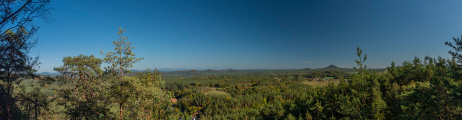 Fototapeta na wymiar View from Sedina hill over deep green autumn forests