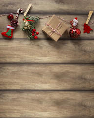 Christmas decorations hanging on wooden background