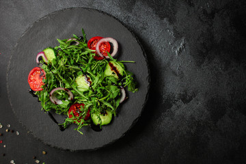 Healthy salad, leaves mix (mix micro greens, cucumber, tomato, onion, other ingredients). food background. copy space. Top view