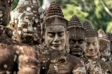 Row of sculptures in the South Gate of Angkor Thom