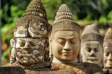 Row of sculptures in the South Gate of Angkor Thom