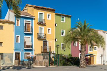 Fototapeta na wymiar Villajoyosa, Comunitat Valenciana / Spain - July 29th, 2019: Colorful houses in the old town center