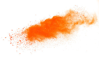 Abstract orange powder explosion isolated on white background.